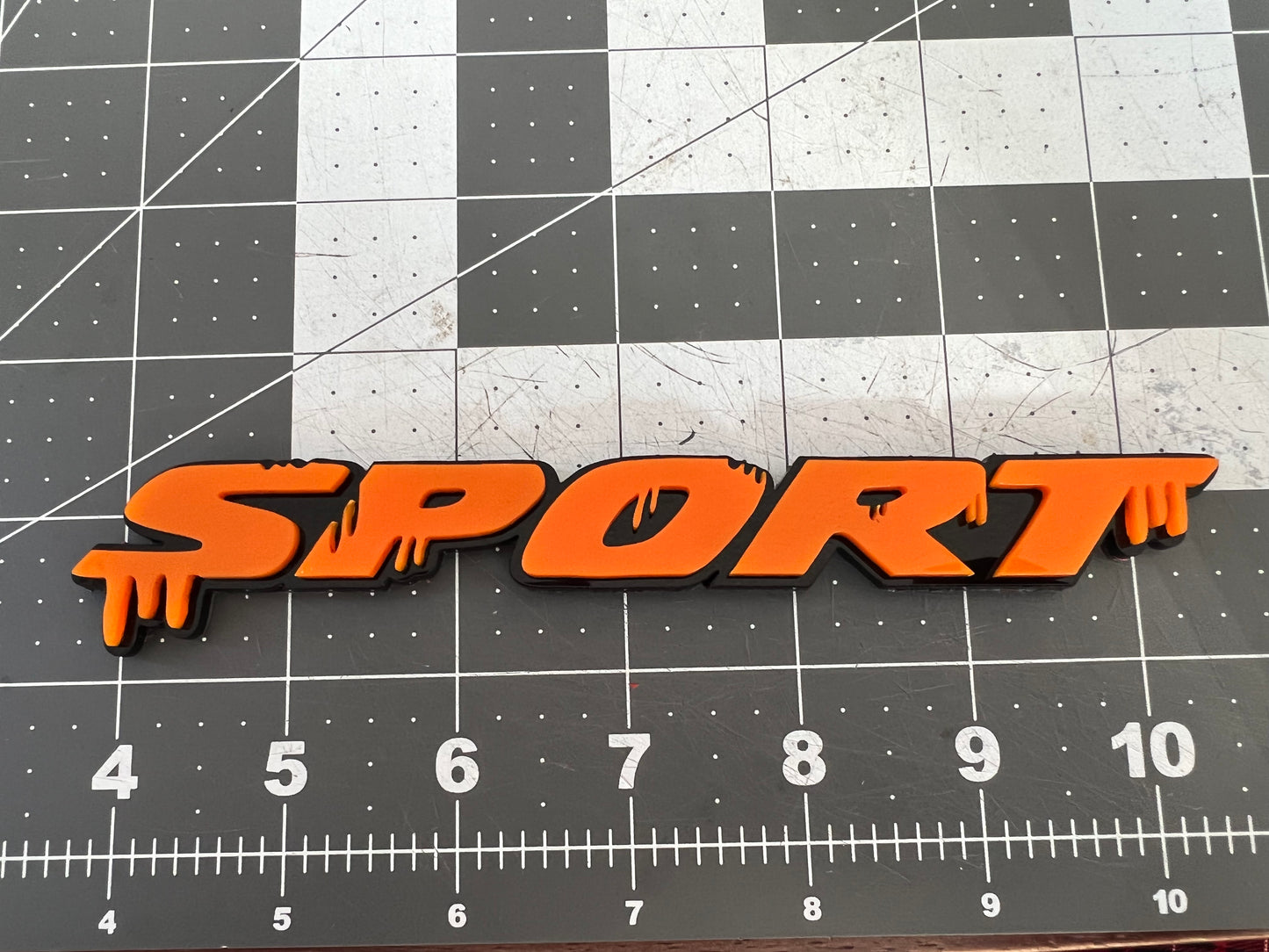 ACRYLIC DRIPPY SPORT EMBLEM